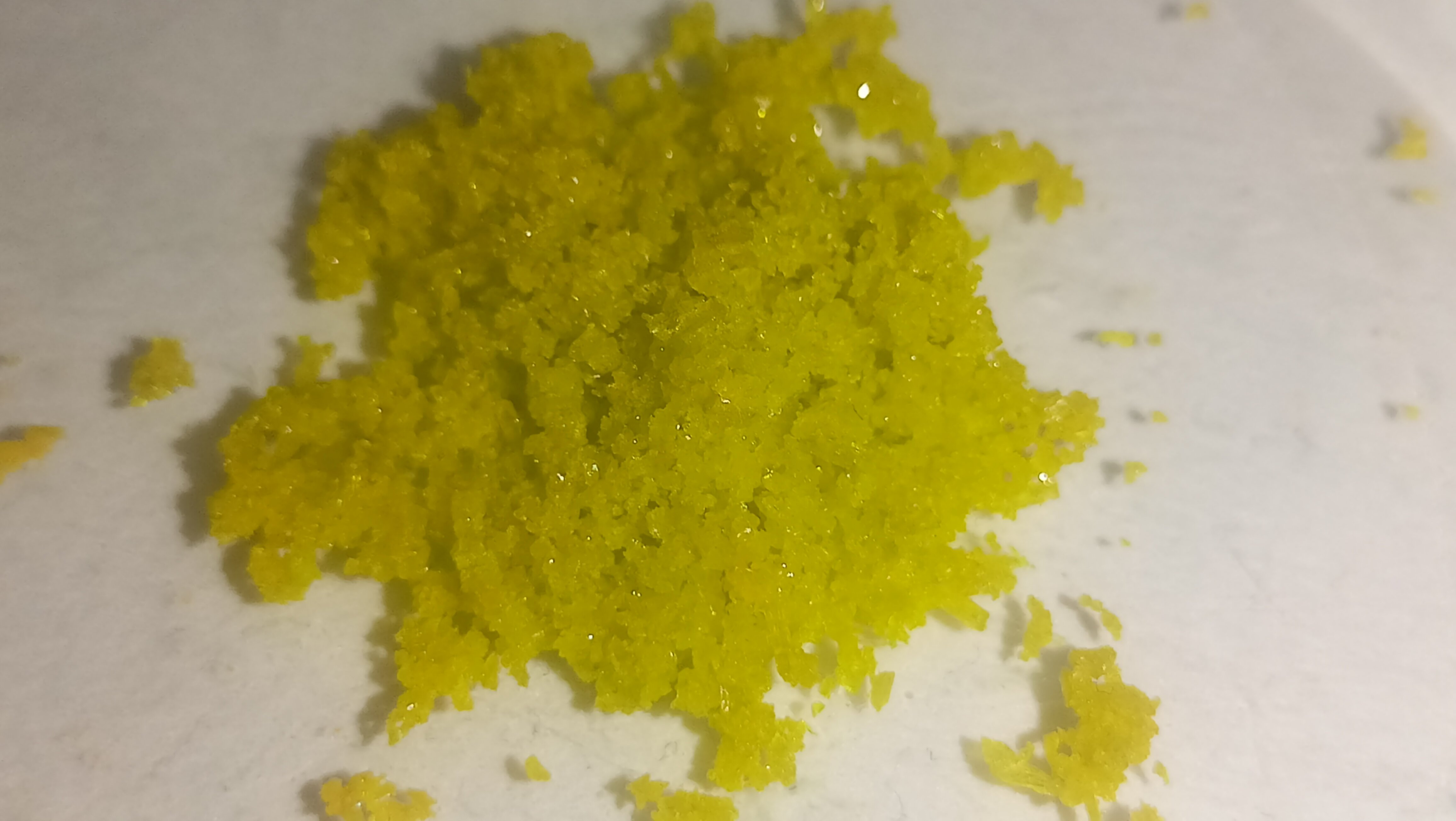 Yellow-Green Crystals on a Dish